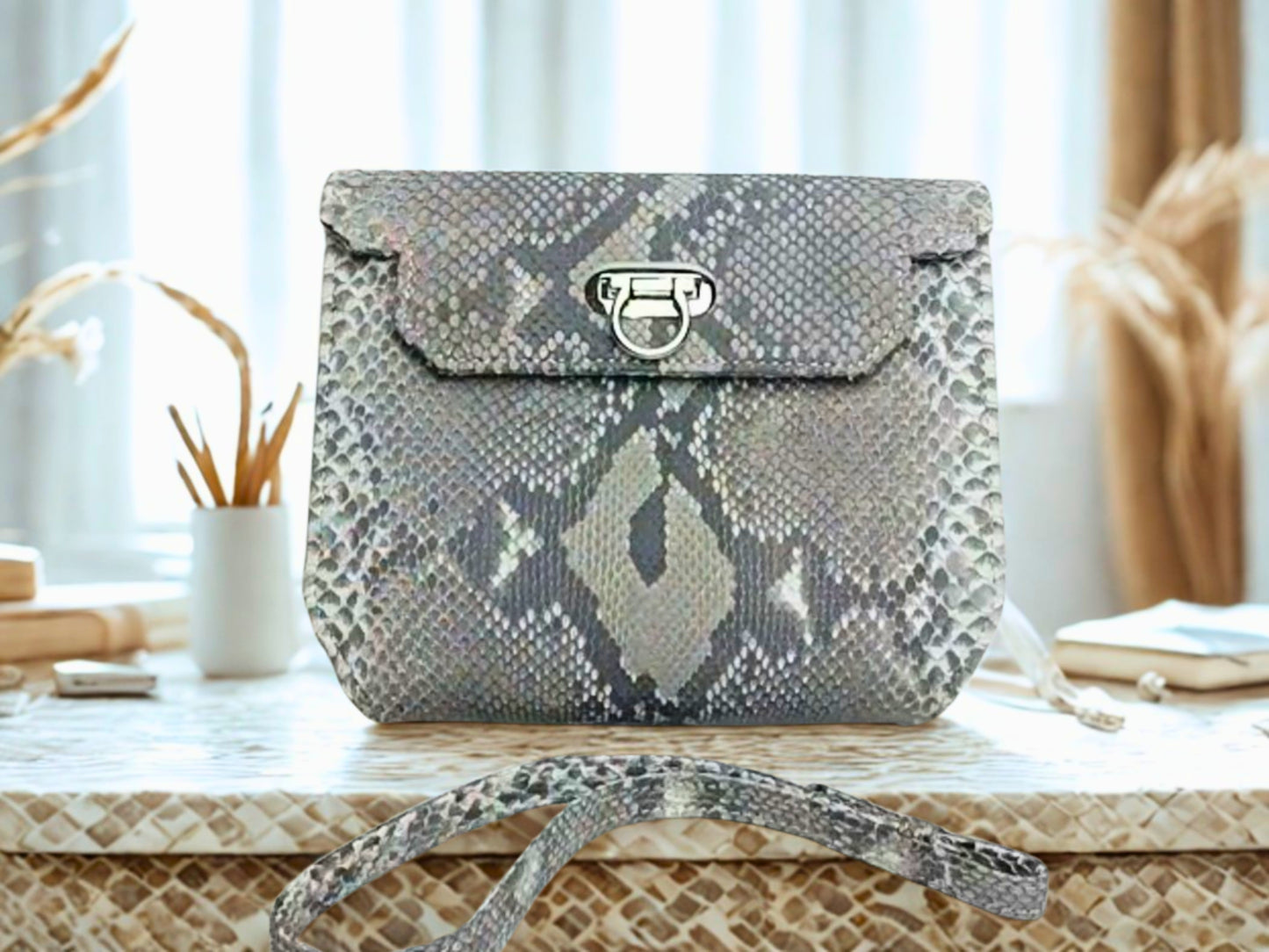 Designer Python Clutch Bags at living room table