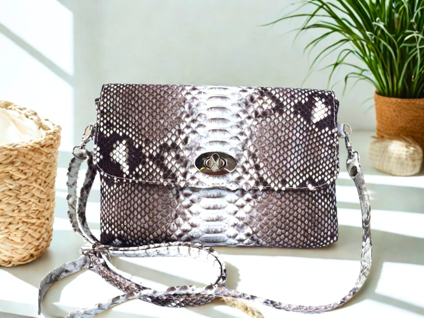 Snakeskin Leather Bag Back Waist Strap - gray color on white table at office