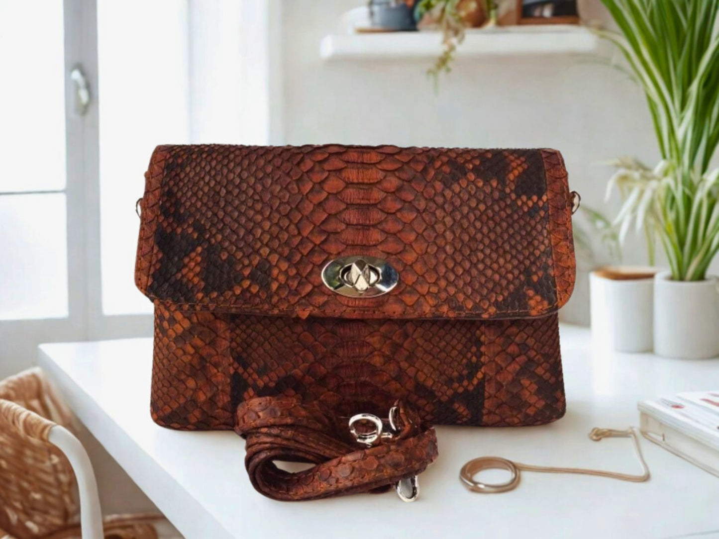 Snakeskin Leather Bag Back Waist Strap - dark brown color on white table at office