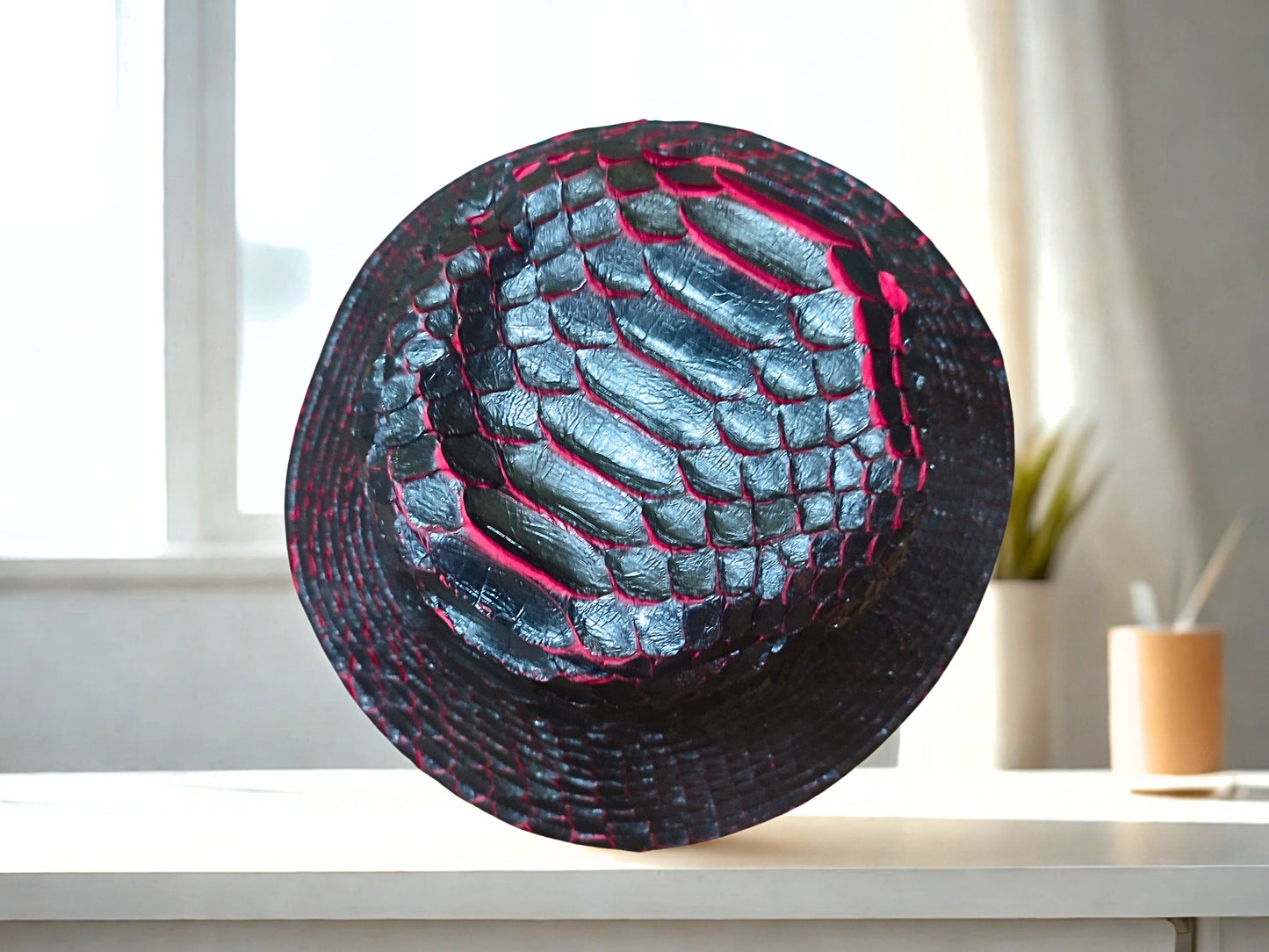 snakeskin bucket hat - black red gradation on top view