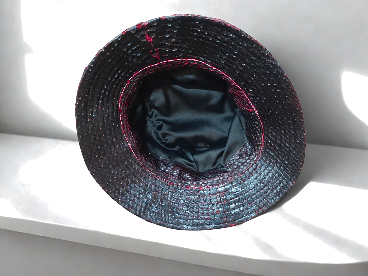 snakeskin bucket hat - black red gradation on inside view with silk lining