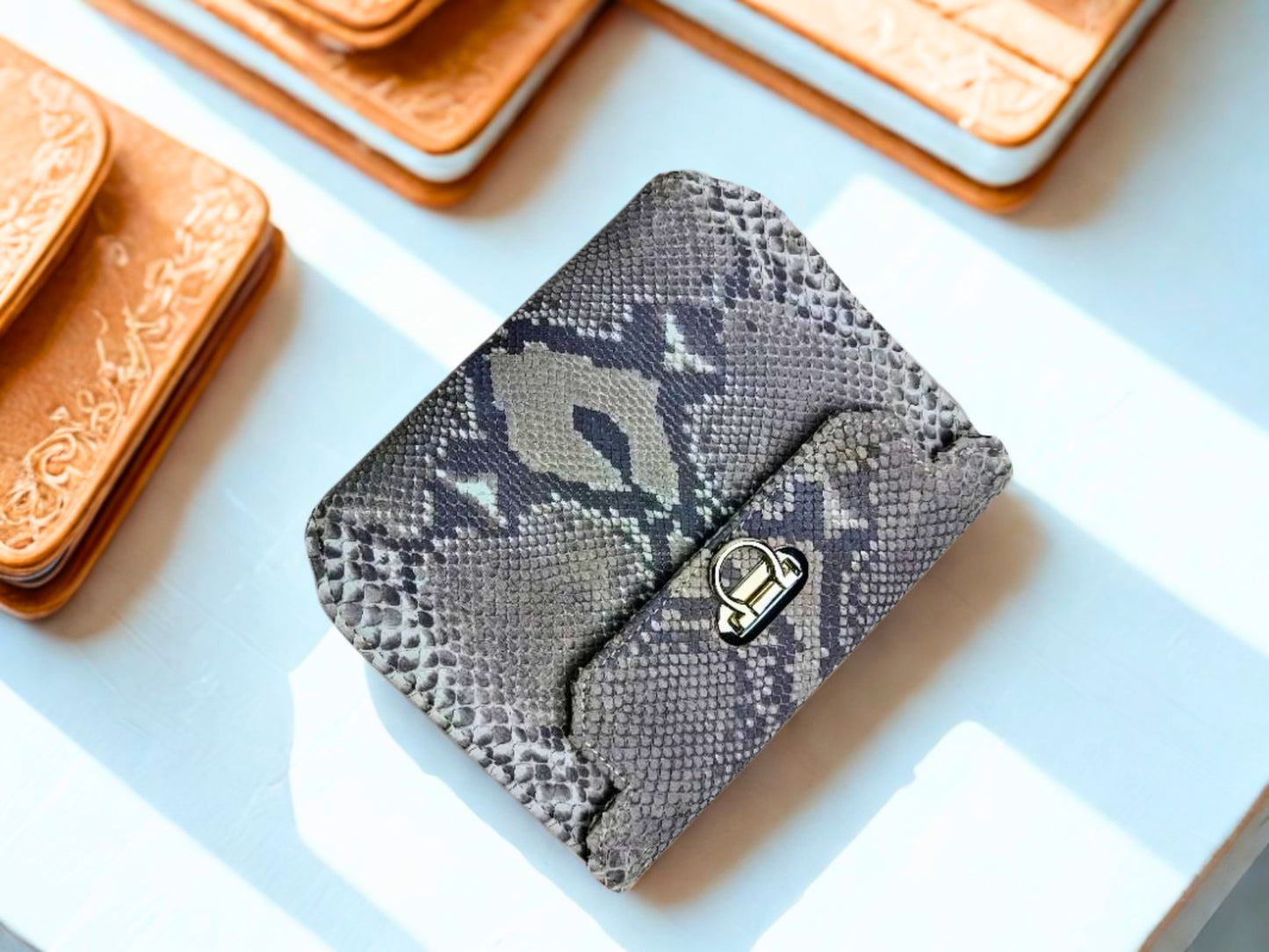 Designer Python Clutch Bags at kitchen table
