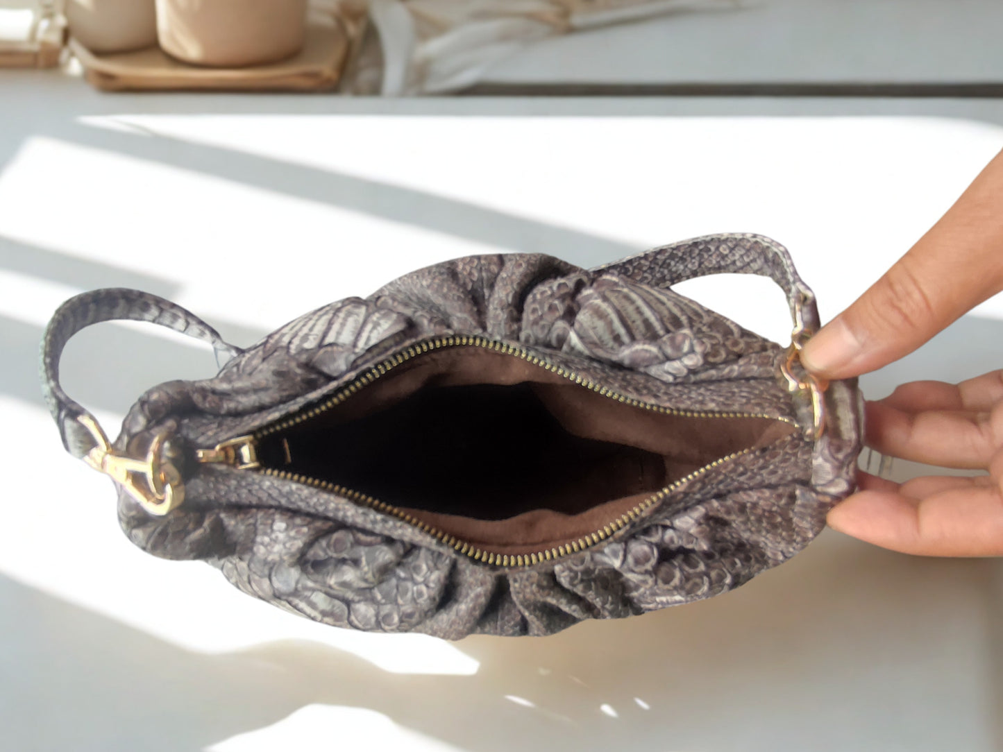 real snakeskin Croissant Small Leather Shoulder Bag on zipper open position and suede lining