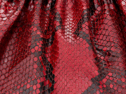 Red and black snakeskin patterned mesh fabric with a glossy, textured scale design.