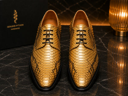 Pair of gold python snakeskin dress shoes with luxury finish