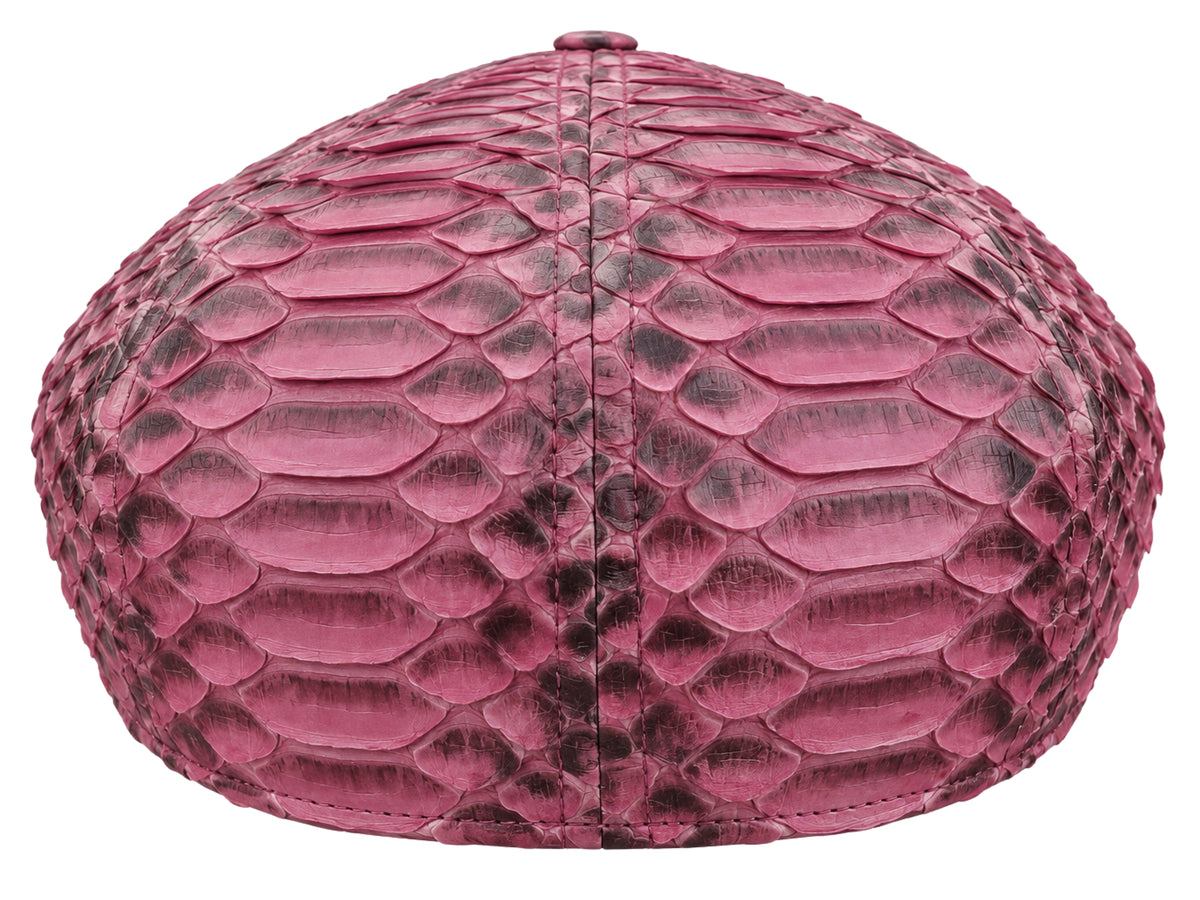 A structured oval cap featuring a vibrant maroon  mottled python skin texture, shown against a plain white background.