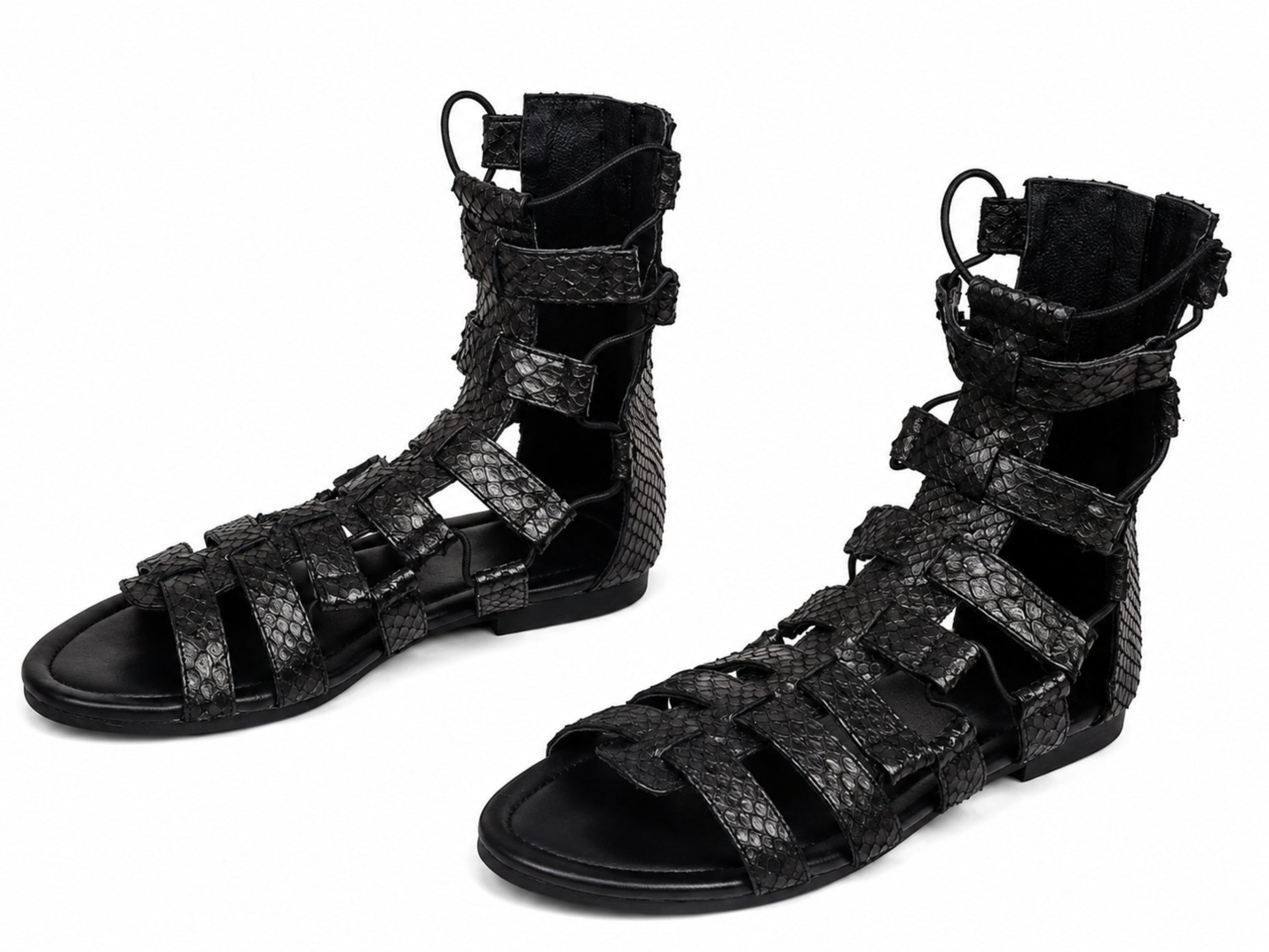 A pair of black strappy gladiator sandals with a textured python-patterned upper, shown on a plain white background.