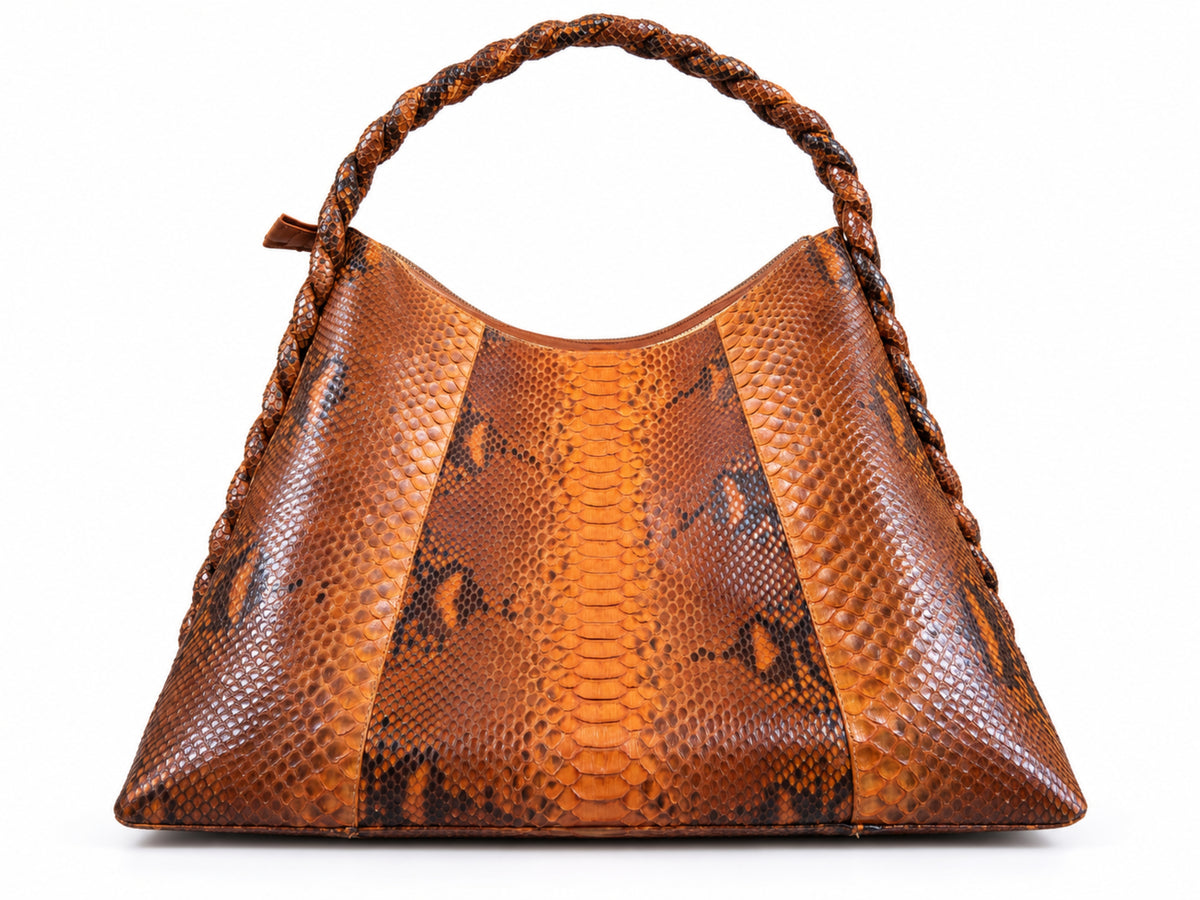 A brown snakeskin-patterned leather handbag with a braided top handle, shown against a plain white background.