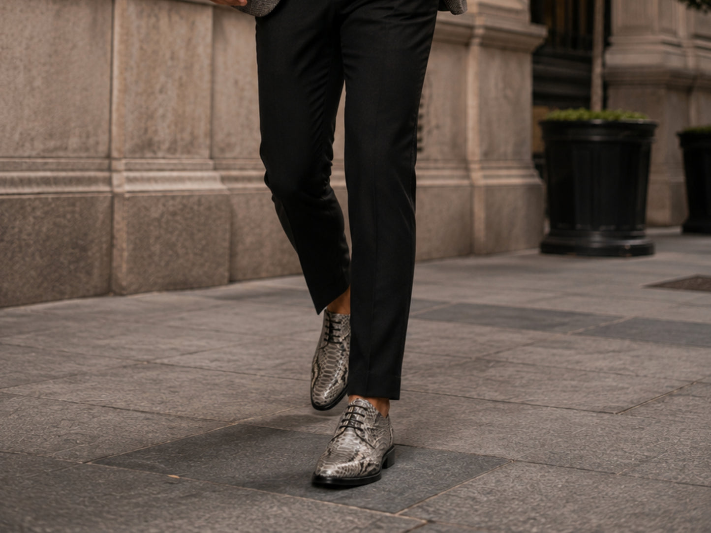 Man walking outdoors wearing natural gray python snakeskin dress shoes