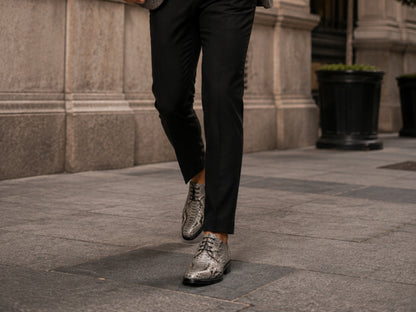 Man walking outdoors wearing natural gray python snakeskin dress shoes