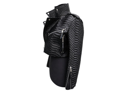 Black textured real snakeskin moto jacket with silver zippers, displayed on a black mannequin torso against a white background.