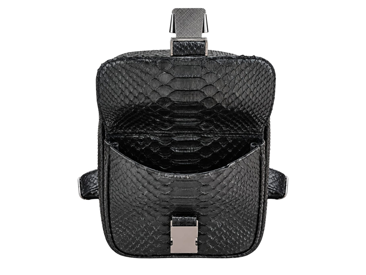 Black textured python leather shoulder bag shown open against a plain white background, featuring a silver-toned metal clasp and a top handle.