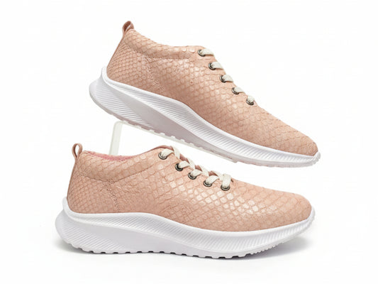 Pair of pink sneakers with white soles on a white background