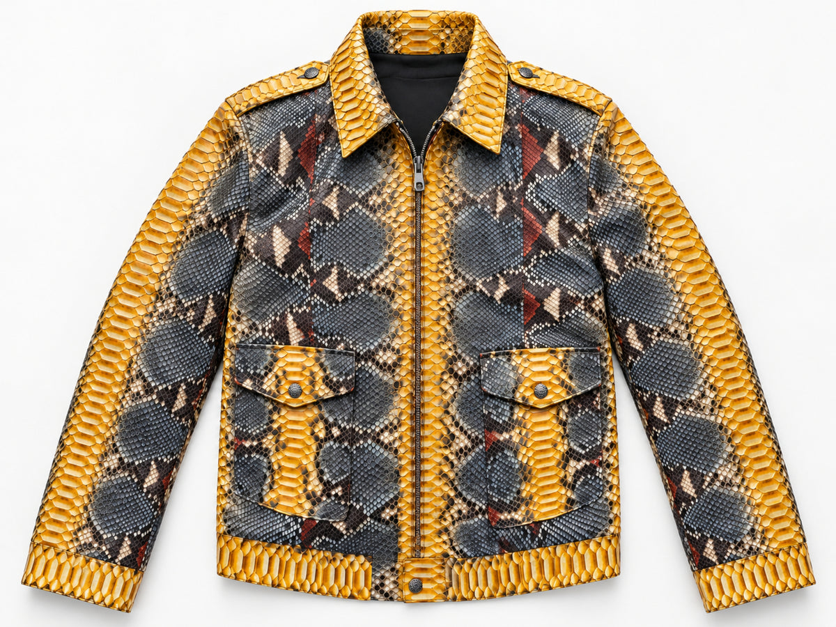 Front view of a men's python snakeskin leather jacket featuring mustard gold panels, charcoal geometric markings, pointed collar, long sleeves, and two flap pockets on a white background.