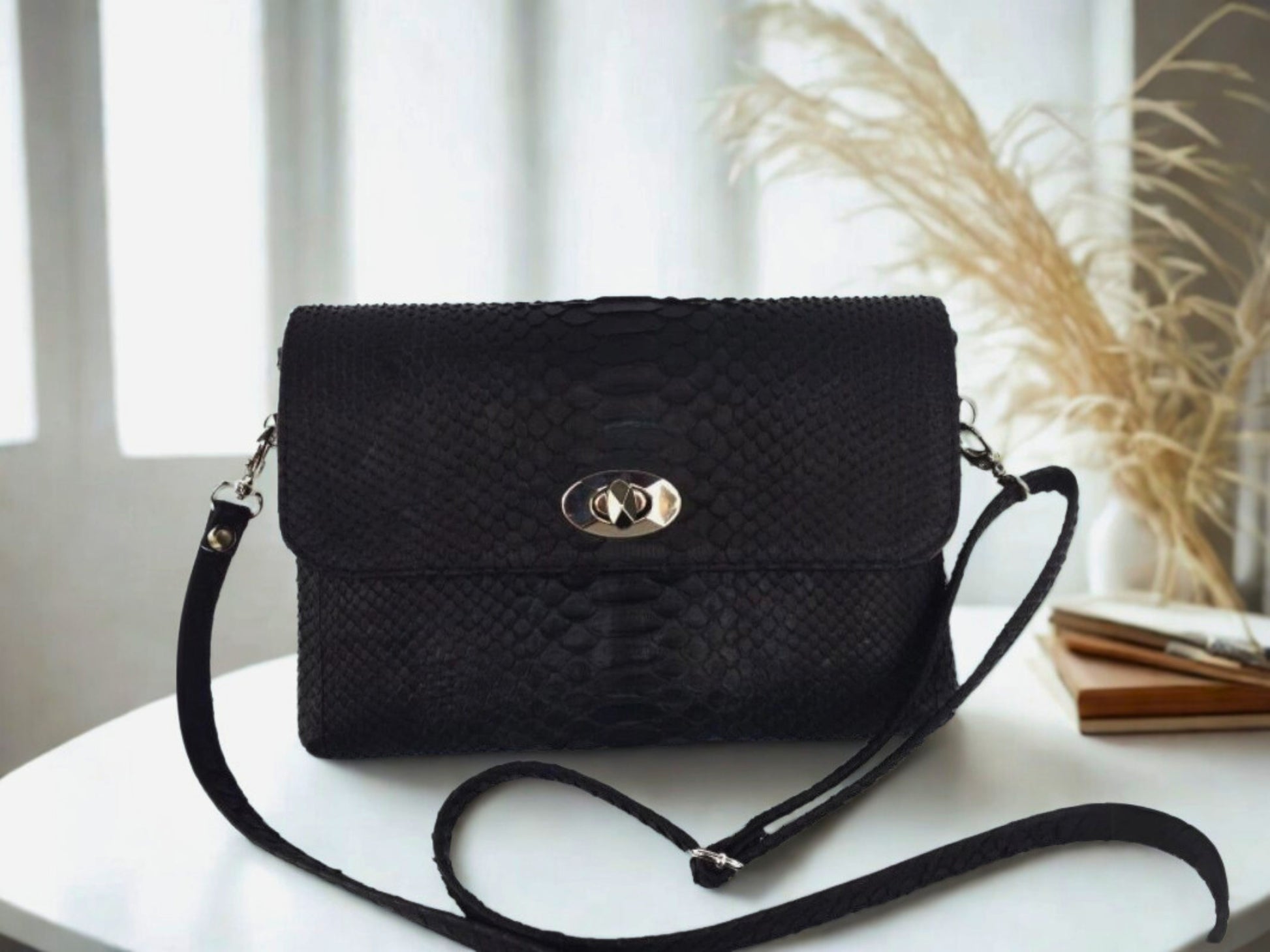 Snakeskin Leather Bag Back Waist Strap - black color on white table at office