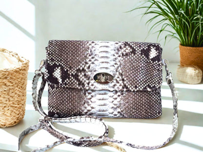 Snakeskin Leather Bag Back Waist Strap - gray color on white table at office