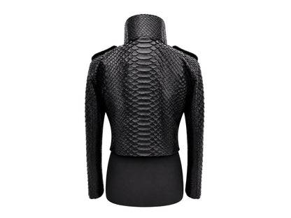 Black textured snakeskin-patterned cropped jacket with a high mock neck and shoulder epaulets, displayed on a black dress form against a white background.