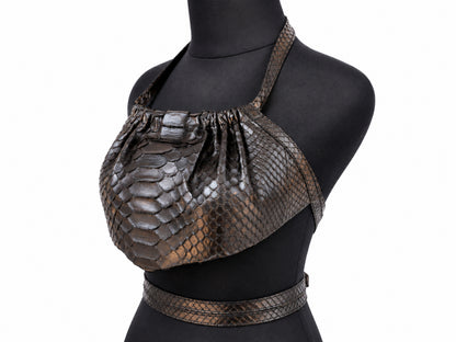 A brown python-skin halter bustier top displayed on a black mannequin torso, featuring a matching snake-print belt.