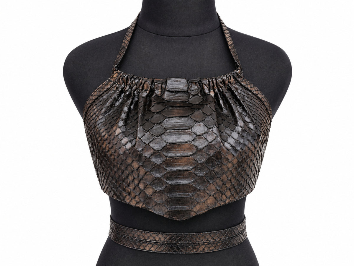 A dark brown python-skin halter crop top with a matching waist belt, displayed on a black mannequin torso against a white background.
