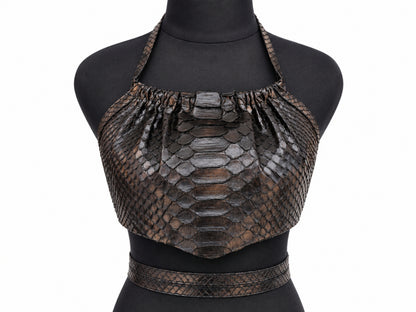 A dark brown python-skin halter crop top with a matching waist belt, displayed on a black mannequin torso against a white background.