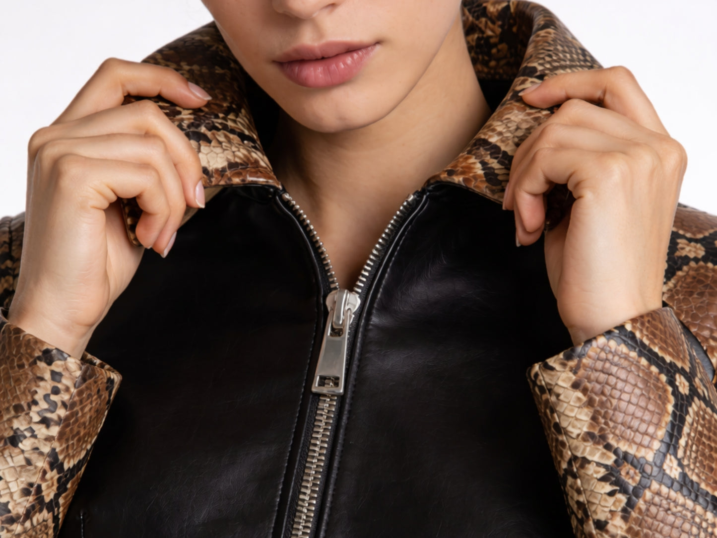 Close-up of woman wearing python snakeskin and lambskin cropped jacket collar detail