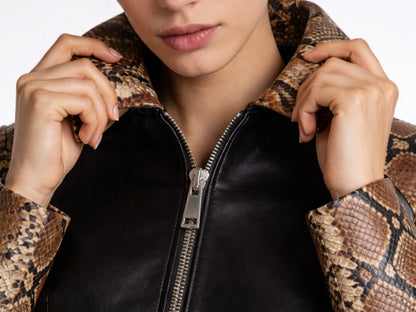 Close-up of woman wearing python snakeskin and lambskin cropped jacket collar detail