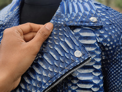 Close-up of a blue textured jacket with a hand touching the fabric