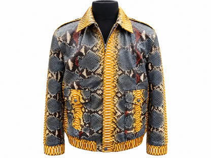 Front view of a men's python snakeskin leather jacket featuring mustard gold panels, charcoal geometric markings, pointed collar, long sleeves, and two flap pockets on a white background.
