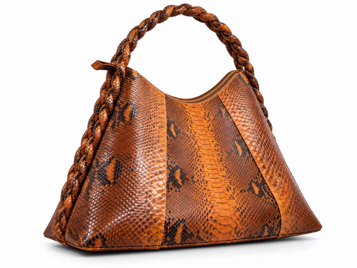 A brown and orange snakeskin-patterned shoulder bag with a braided top handle, shown on a plain white background.
