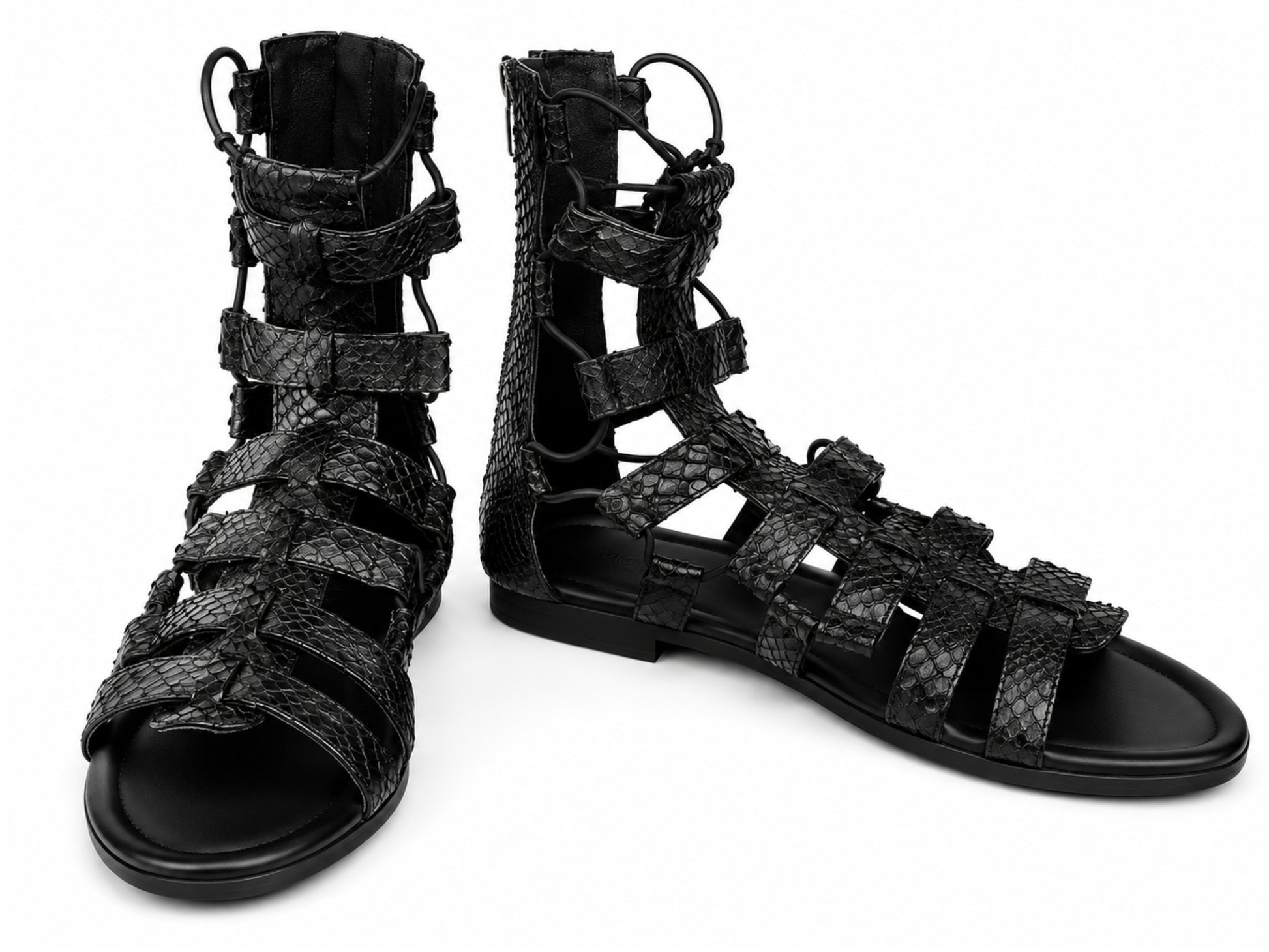 A pair of black strappy gladiator sandals with a textured python-skin pattern, shown on a plain white background.