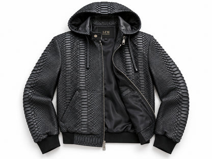 A black hooded bomber jacket featuring textured snakeskin-patterned panels on the hood, shoulders, and sleeves, with a smooth black satin front panel and black ribbed cuffs and hem.