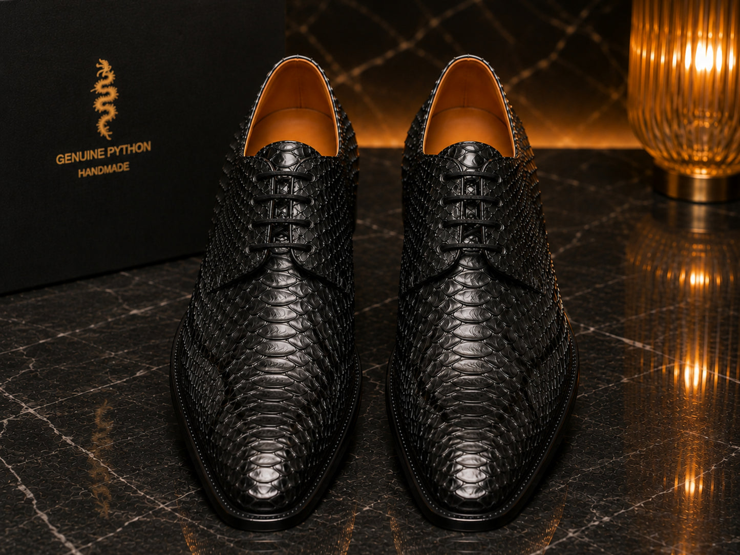 Pair of black genuine python snakeskin dress shoes with glossy natural scales