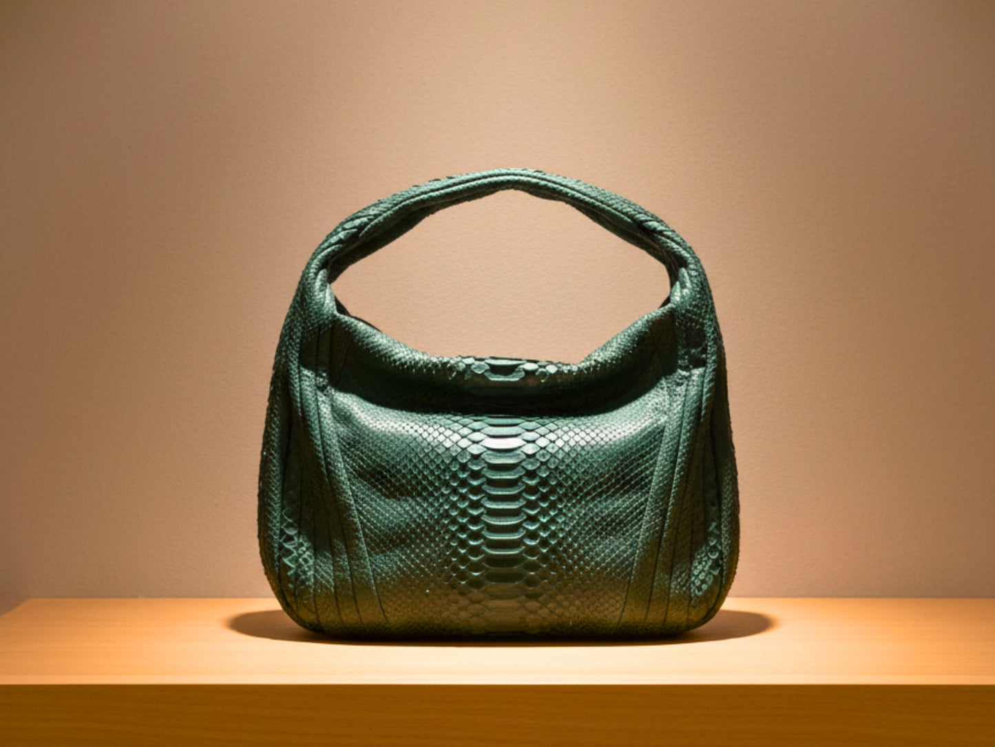 Green textured handbag on a wooden surface with a beige background