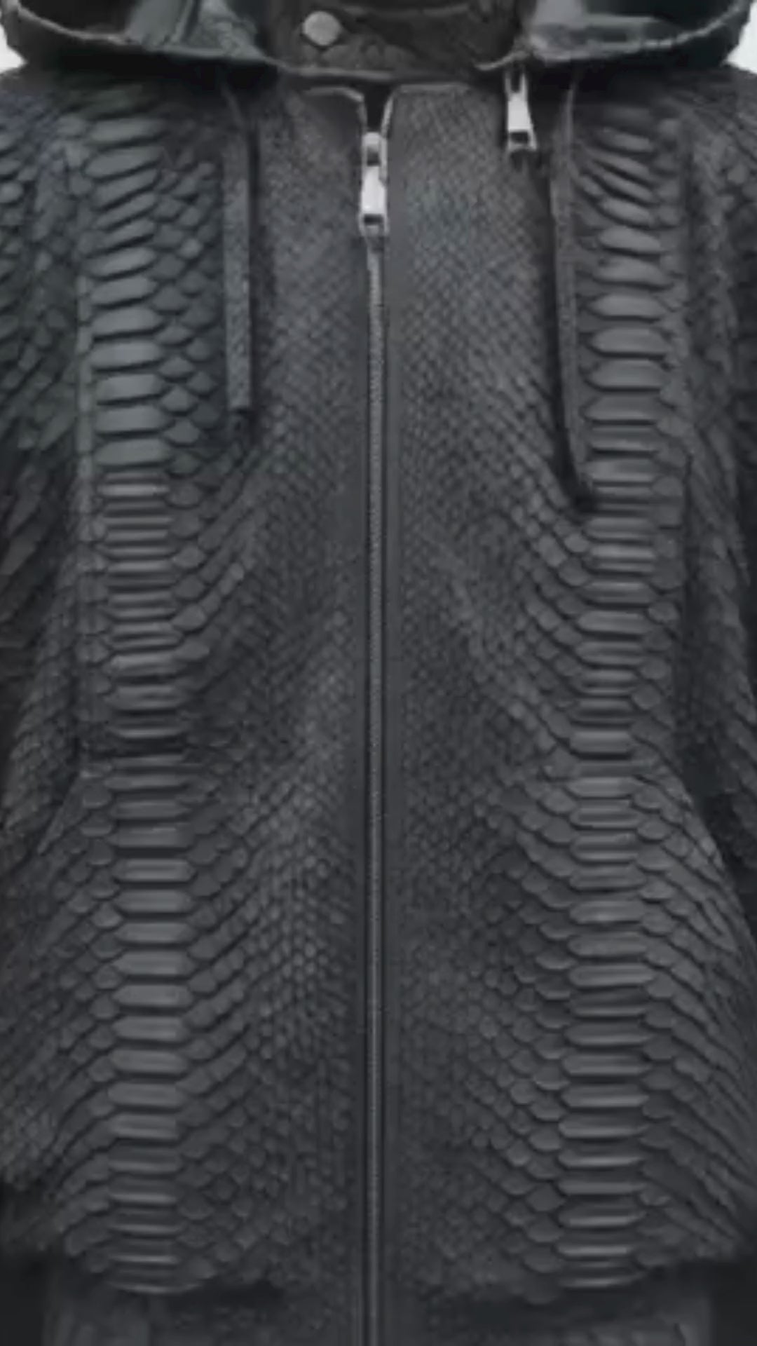 Black python snakeskin hooded bomber jacket with full zip front and textured scale pattern