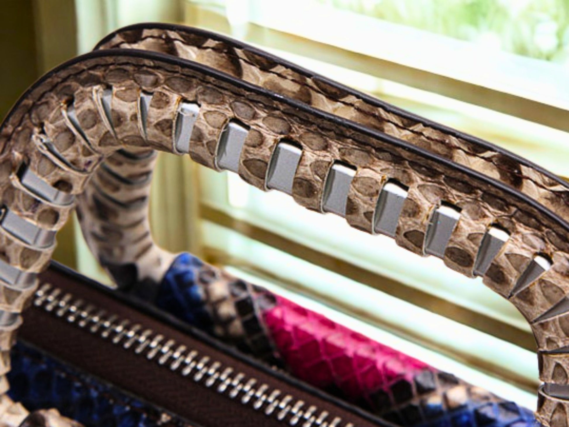 Top Handle Snakeskin Bag on metal handle view